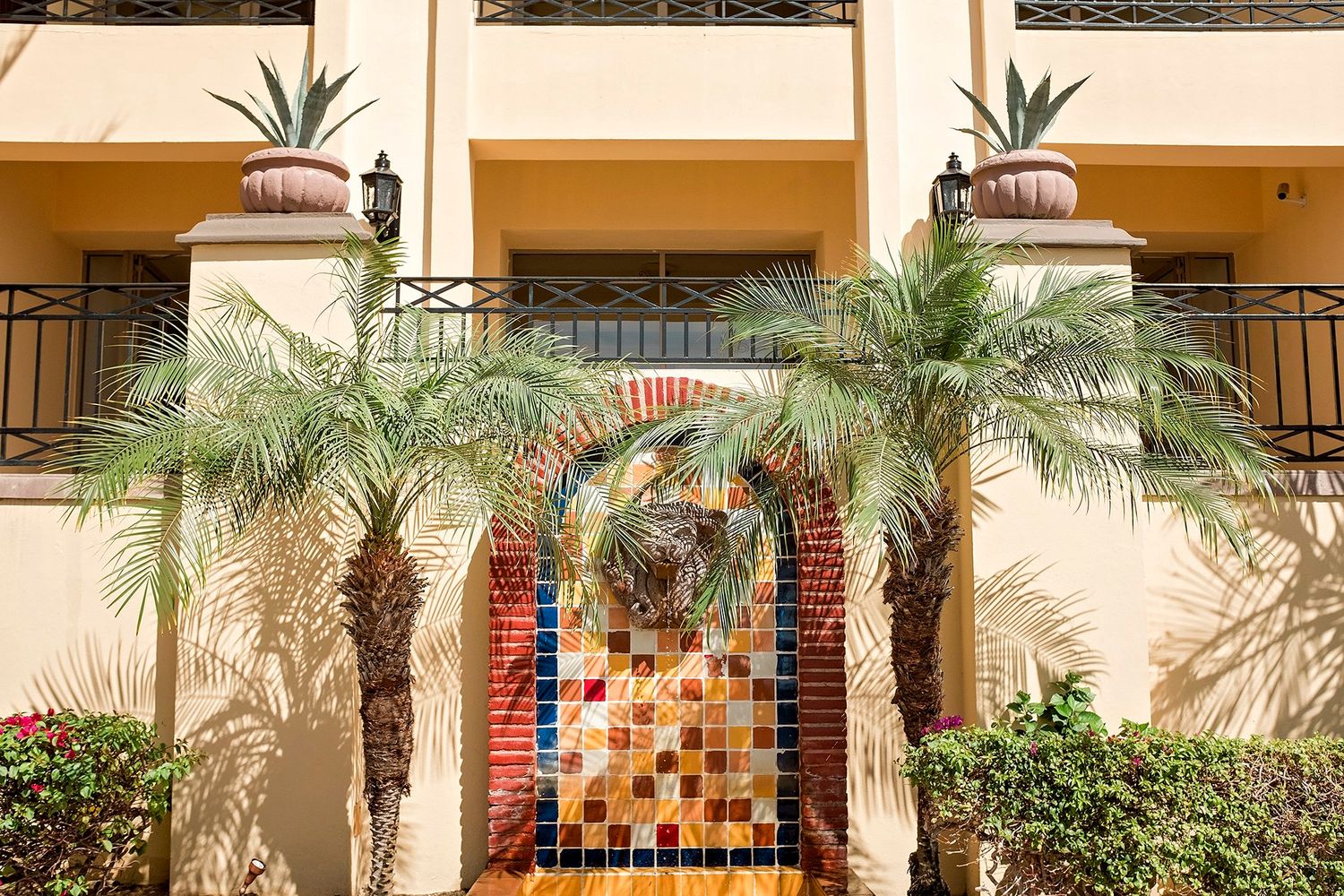 A lion’s head fountain, located at the base of Buildings 19-20.