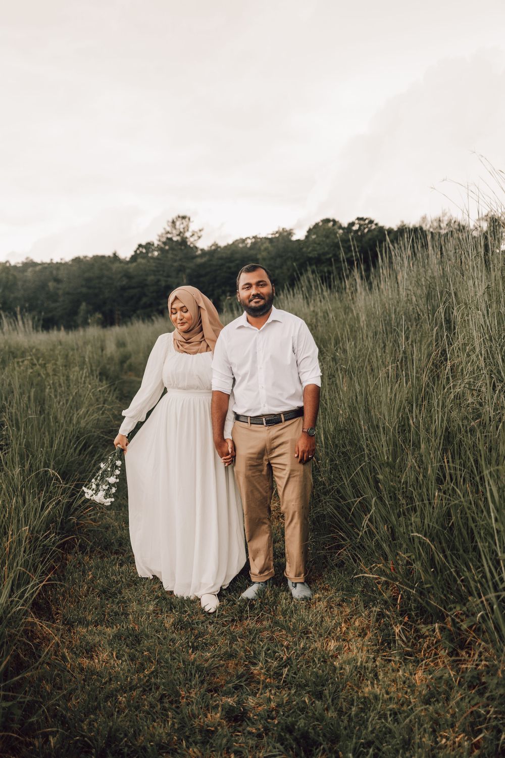 Indian couple in a field with flowers