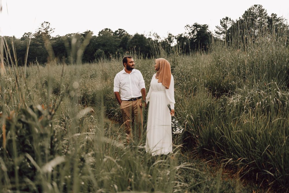 Indian couple standing in tall grass