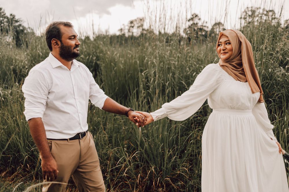 Indian woman looking back at husband