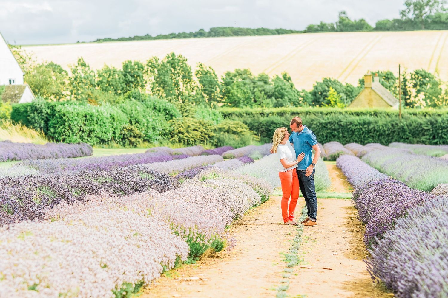 Hayley Elizabeth Photography Cotswolds Photographer Lavender engagement session Snowshill couple stood embracing