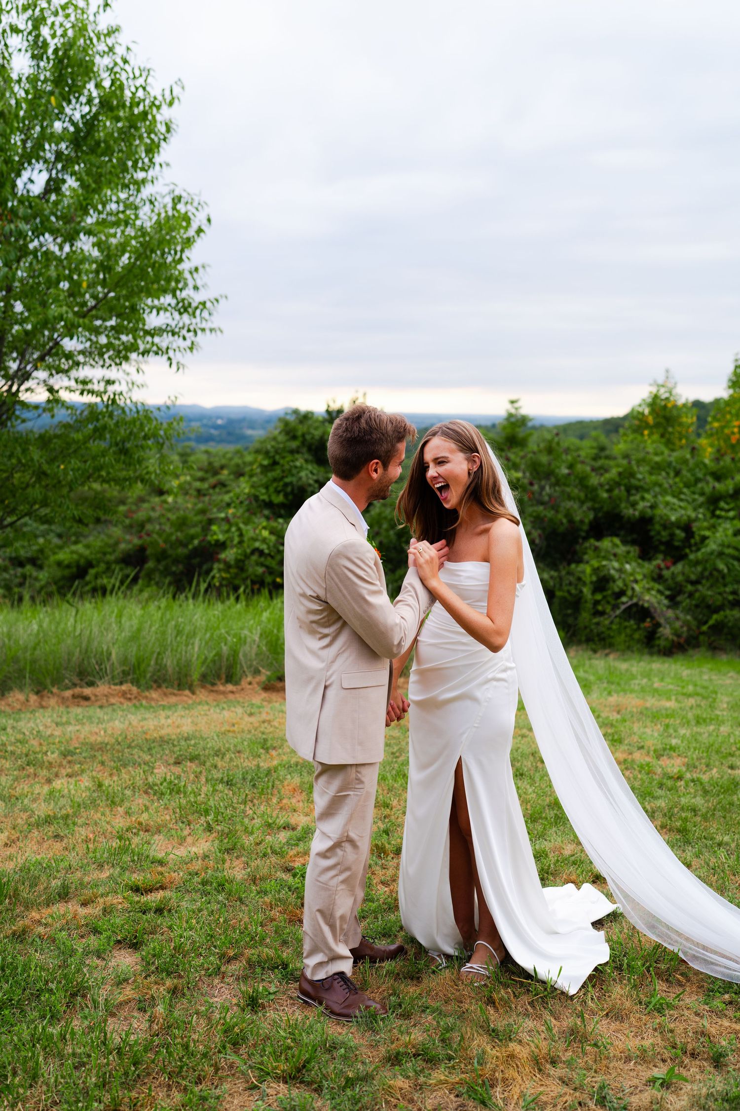 Bride and groom joyfully and playfully embracing and laughing. Hocking Hills,Oh