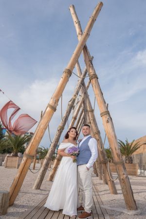 Natural wood post installation creates a unique architectural feature on a beach setting.