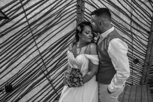 Black and white wedding portraits showing tender moments against geometric backdrop.