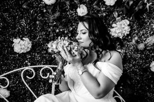 Artistic black and white wedding portraits with elegant poses and dramatic lighting effects.