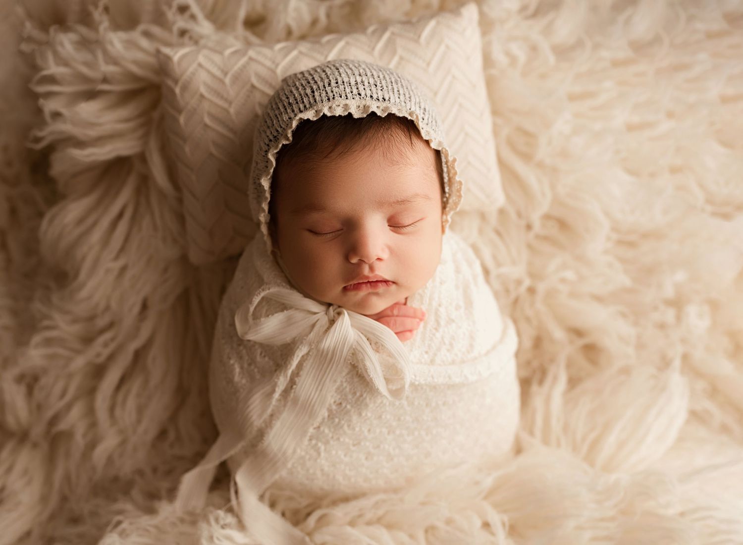 newborn girl in white swaddle and cap, inland empire baby photographer