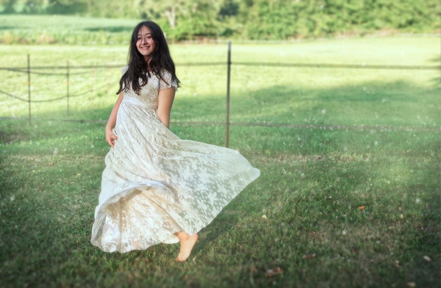 Portrait of young girl posing playfully in dress.