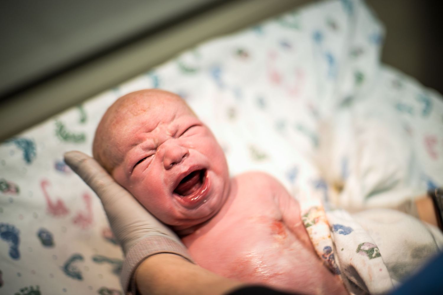 Nurse cleaning off a newborn baby just after birth at UnityPoint Health in Sioux City, IA.