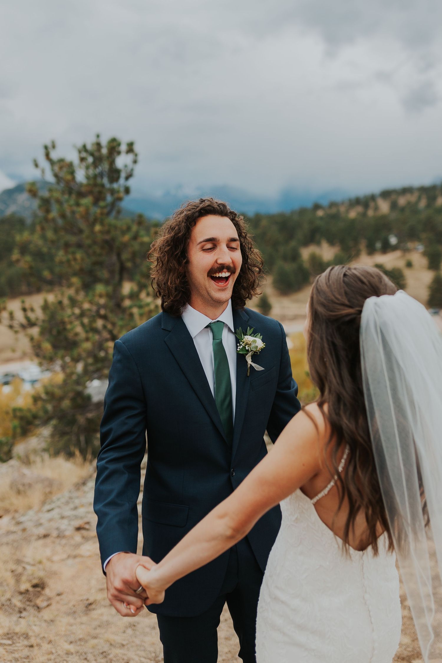 Groom and bride first look Bride and father first look Estes Park, Colorado wedding photographer