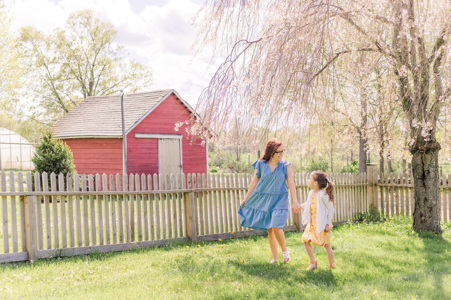Mother and daughter walking during a photo session with Danielle Lauren Photography