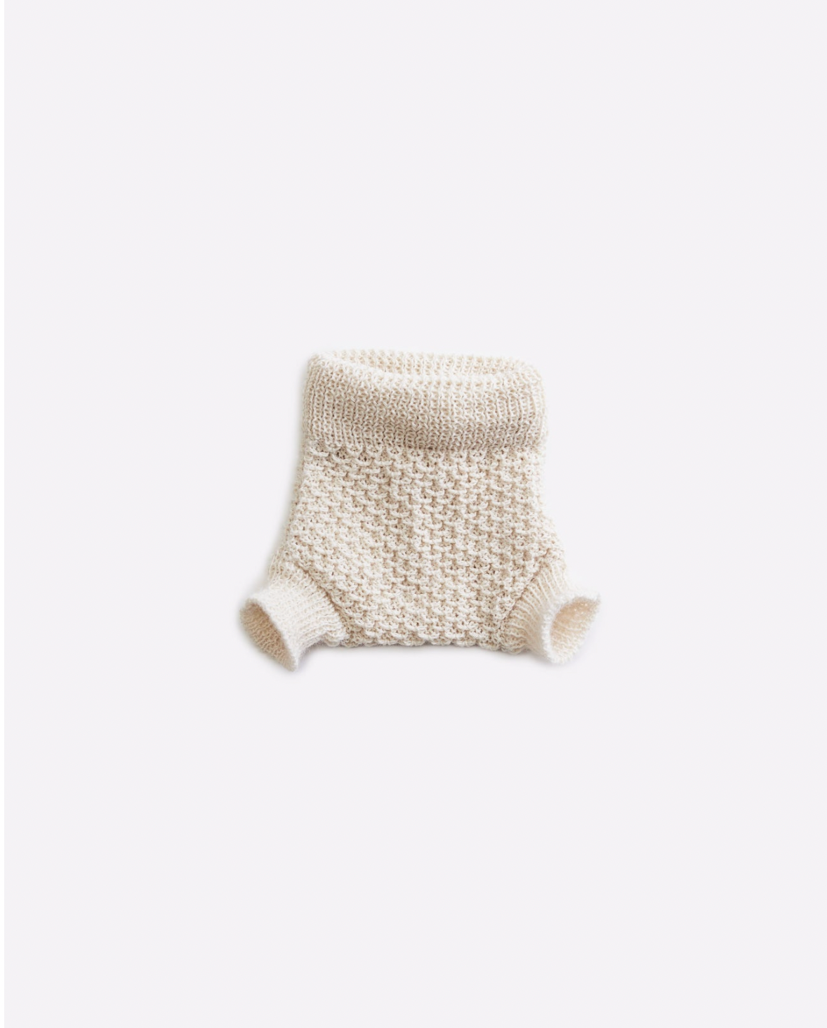 White knitted baby diaper cover with textured pattern design.