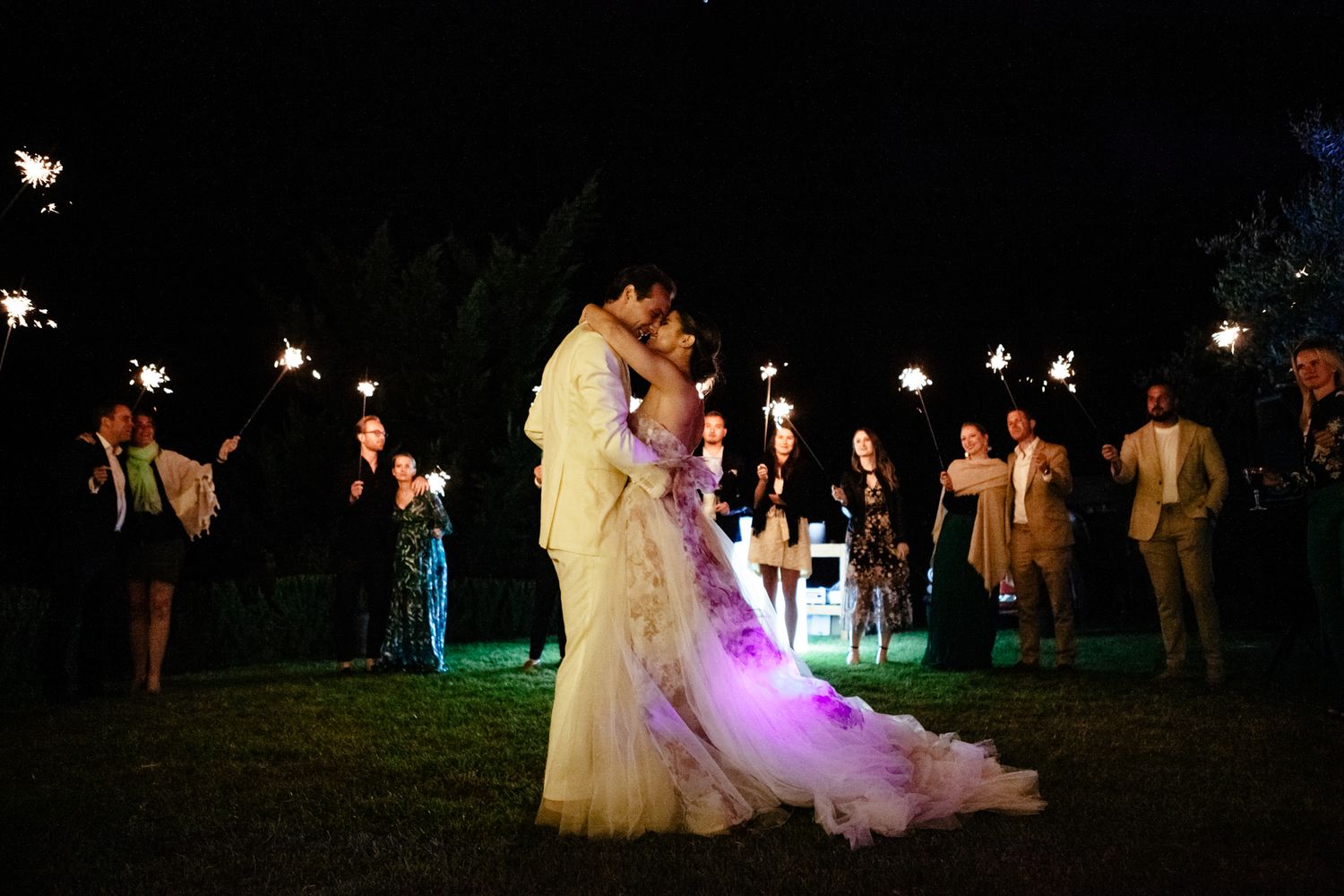 first dance with guests holding sparklers