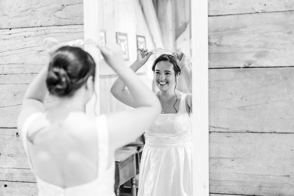A joyful moment captured in a mirror reflection with rustic decor.