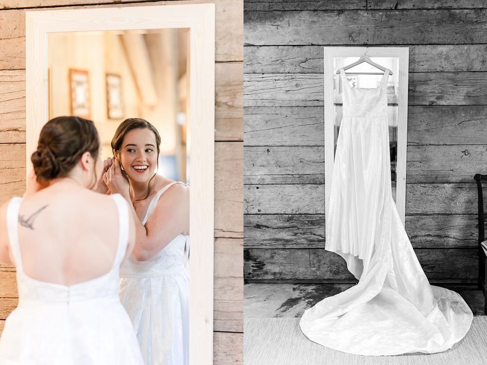 A wedding dress with long train hanging against rustic wooden wall.