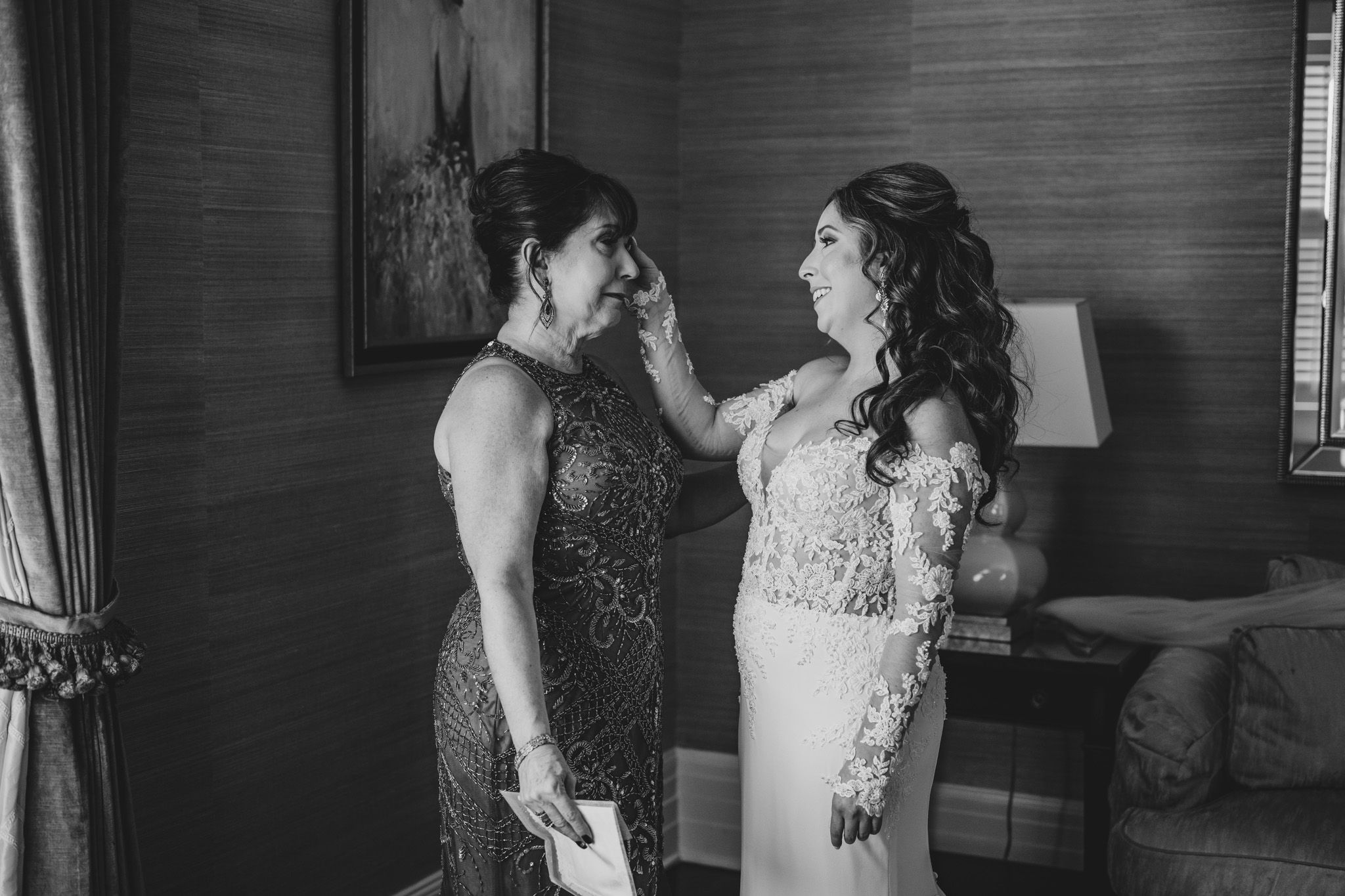 Emotional getting ready moments captured in black and white photography.