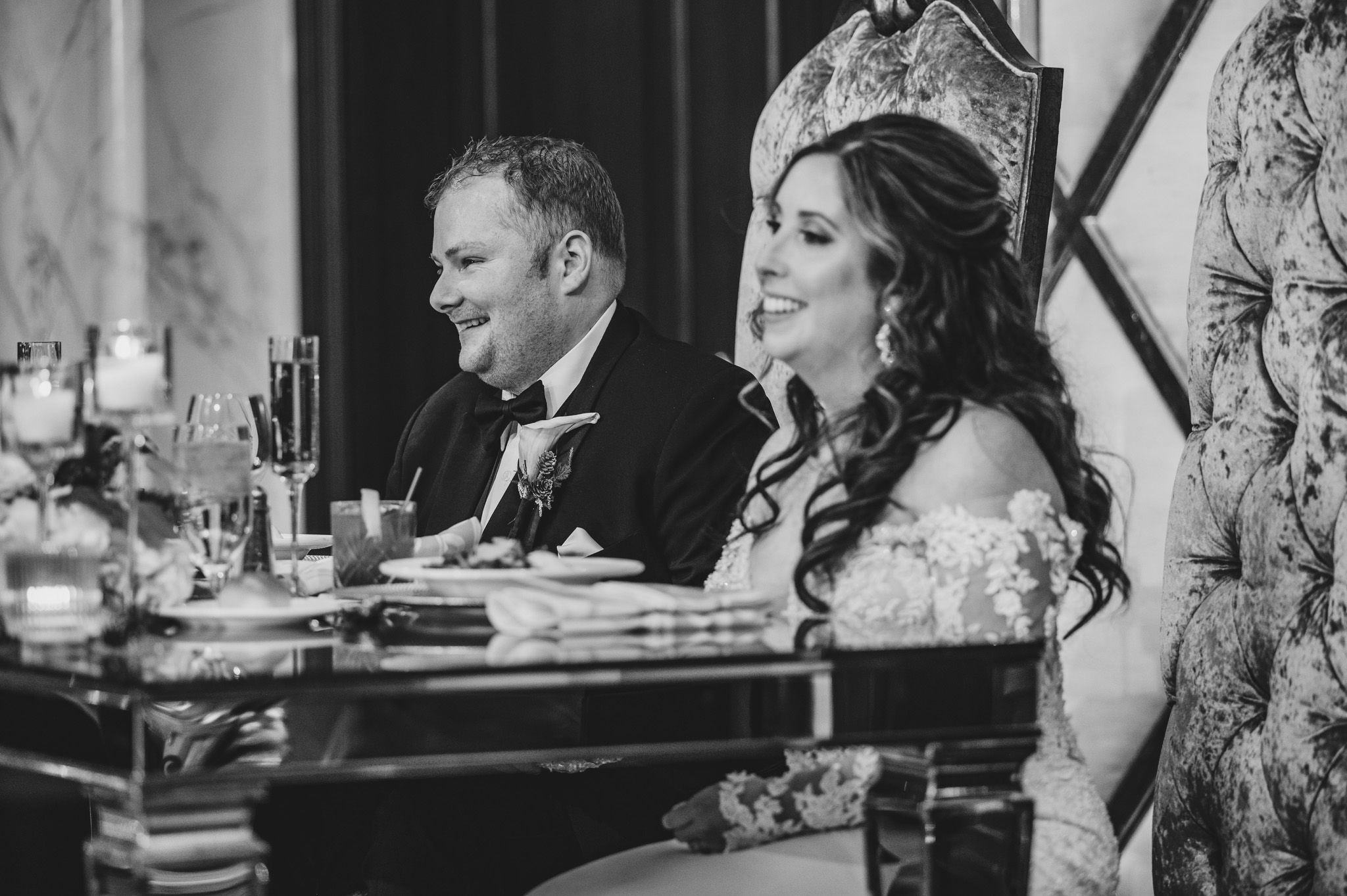 Candid reception moments captured at an ornately decorated wedding venue.