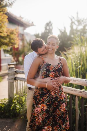 Tender moment captured between couple during golden hour portrait session.