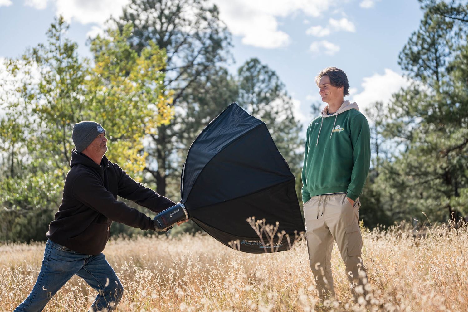 Jake Weidinger goofs with his dad for Flagstaff photographer, Sean Openshaw, for his 2022 senior photos.