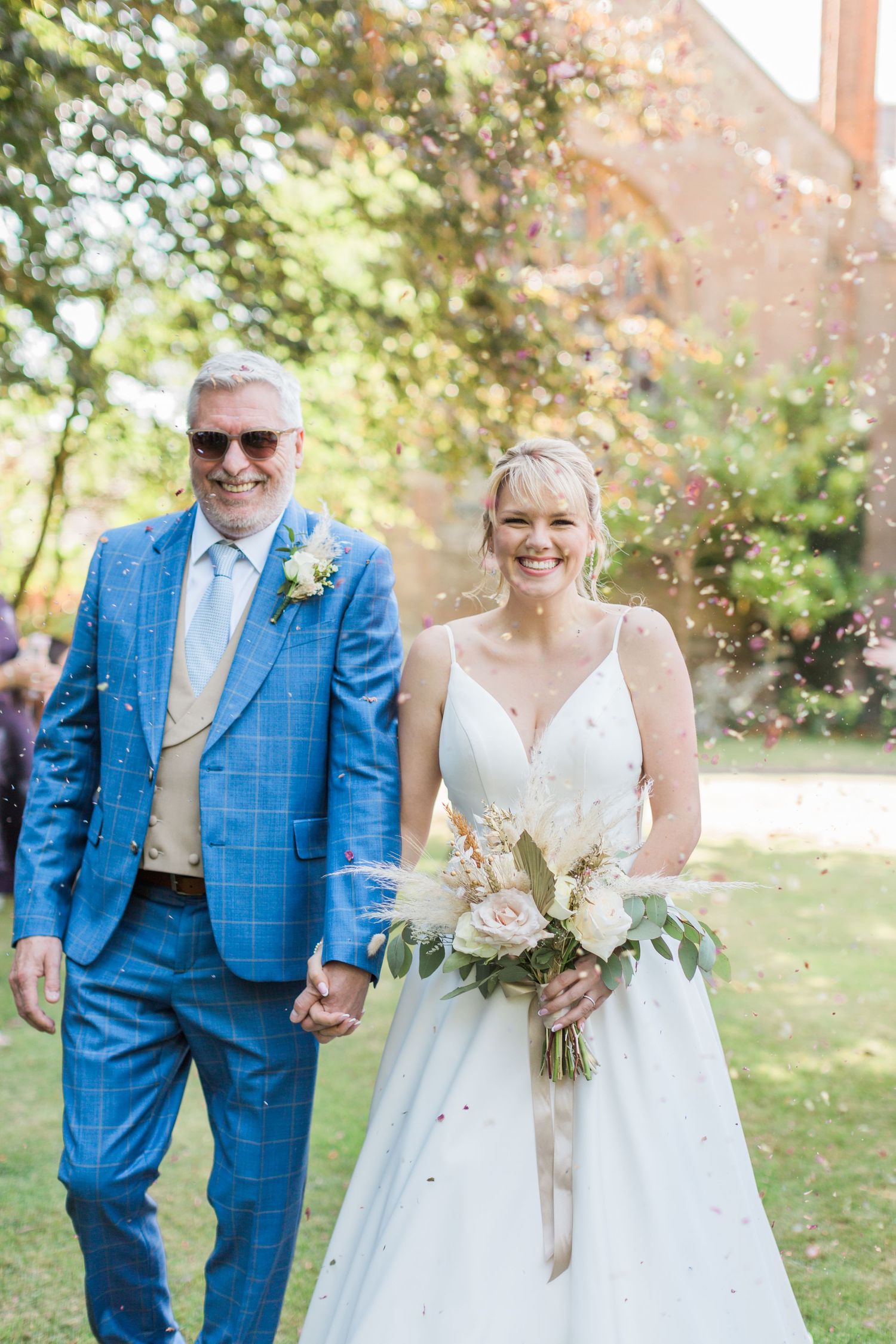 Hayley Elizabeth Photography Cotswolds wedding photographer Grafton manor worcestershire couple under confetti