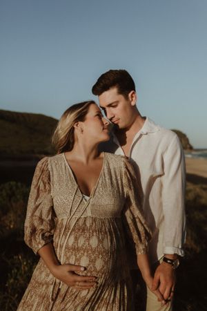 Pregnant Couple on the beach, Newcastle Family Photographer