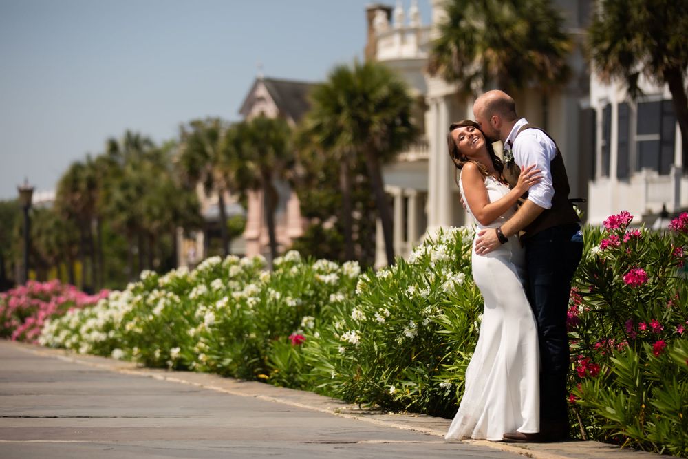 Bride and groom on the Battery in Spring oleanders in bloom