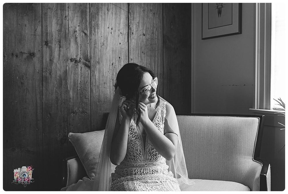 Black and white portrait of a joyful moment in an intimate indoor setting.