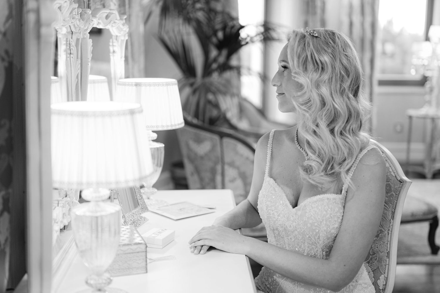Elegant dressing room scene with ornate mirror and soft lighting.