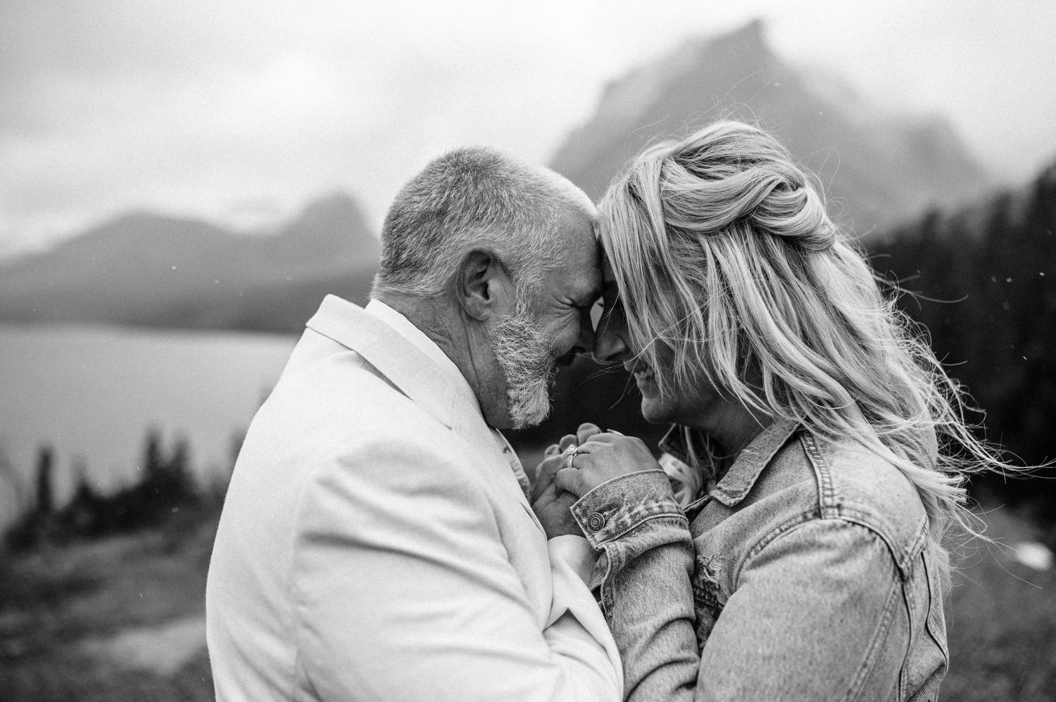 couple getting married at sun point in glacier national park