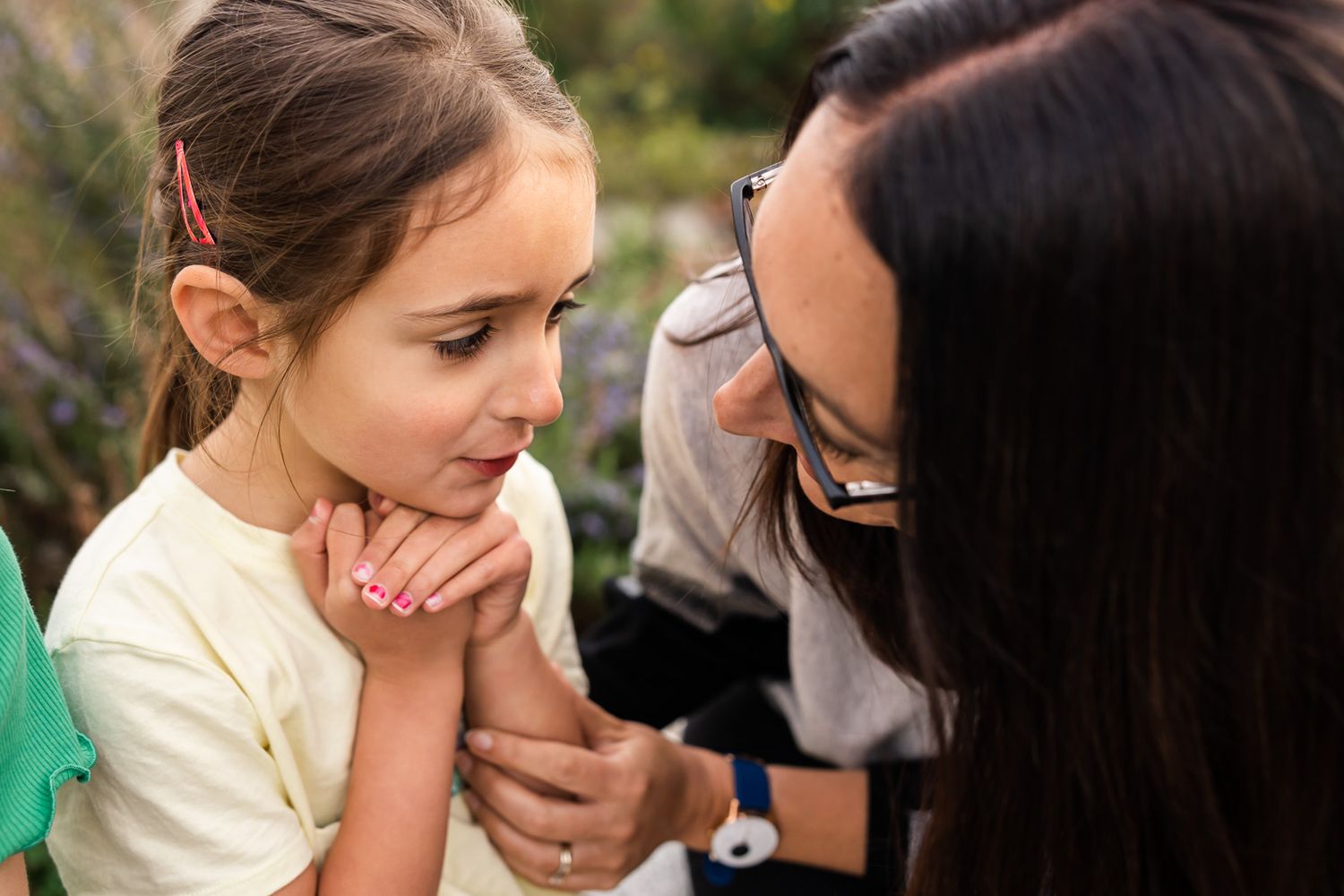 Bellevue photographer captured tender candid moment between mother and daughter.