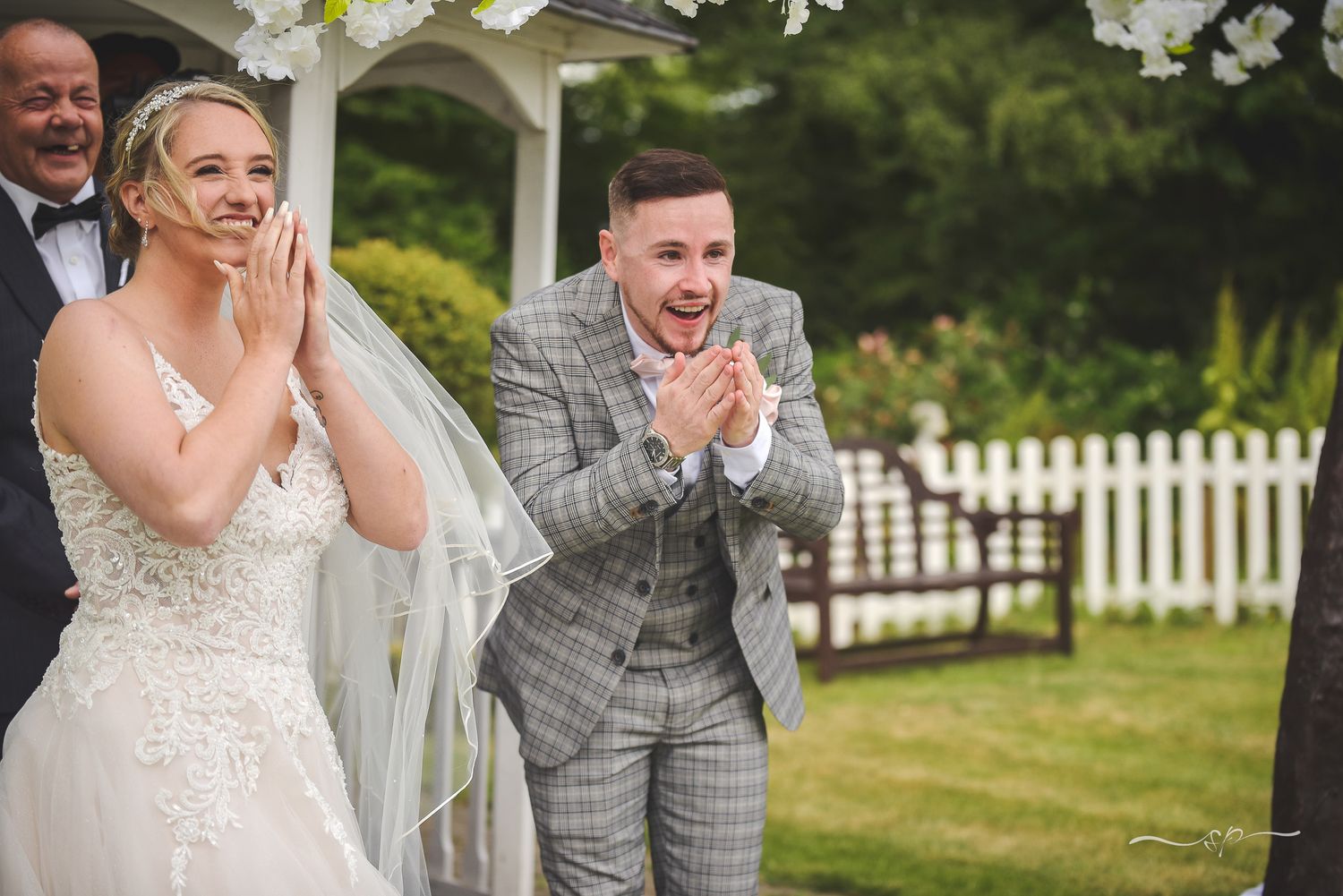 A groom surprised at the altar by the best surprise organised by his bride, wedding photography.