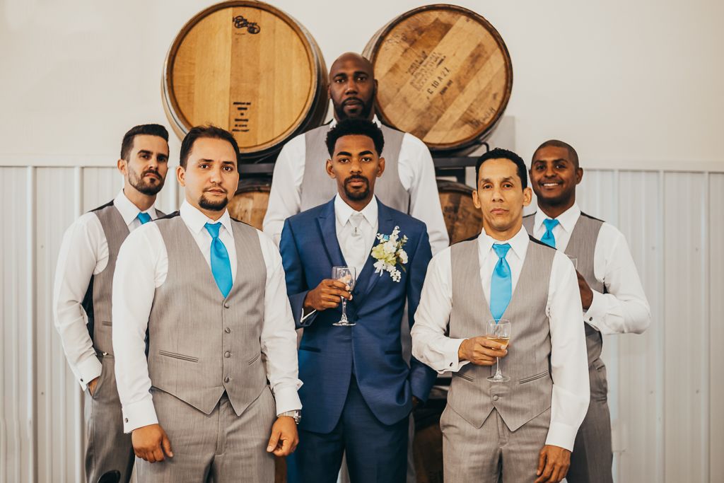 dapper groomsmen having a drink