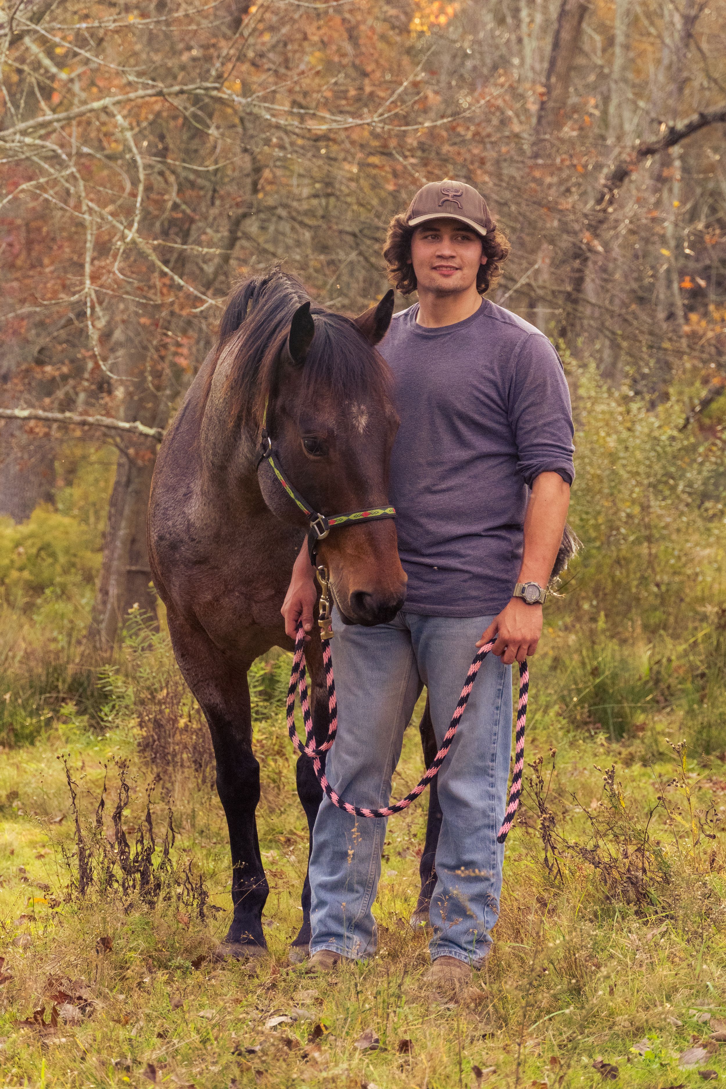 man in hat with horse