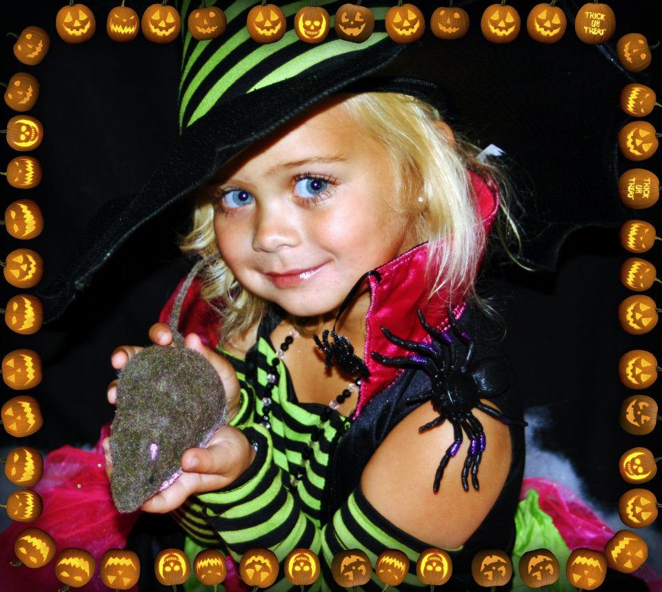 Child in Halloween costume with striped shirt and spider decoration surrounded by jack-o-lantern border.
