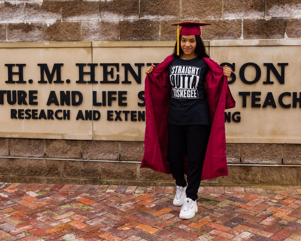 african american girl in graduation outfit on the campus of Tuskegee University