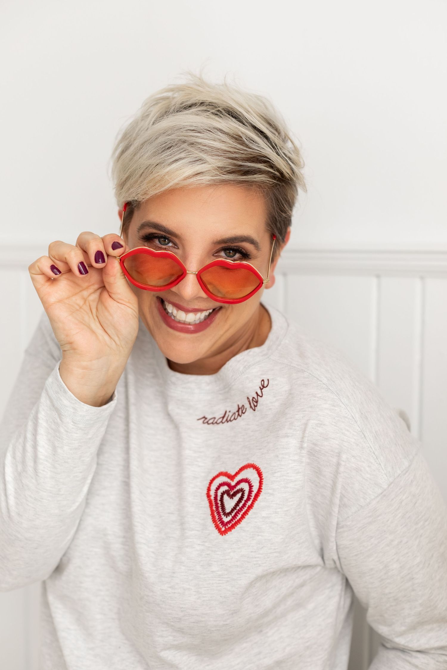 Aly Darin teasing camera with sunglasses and smile. Beverly Hills senior photographer