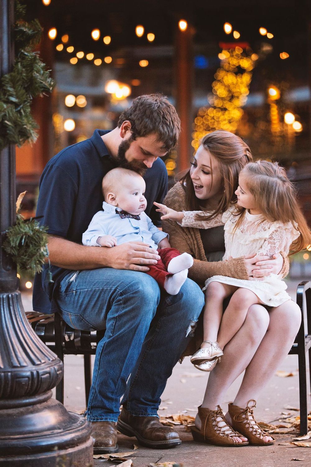 A young beautiful family enjoying their Christmas mini photo session in Knoxville, Tennessee