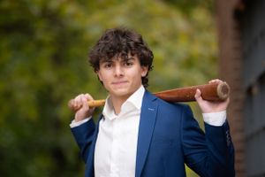 Professional headshots of people in formal attire against a blurred natural background.