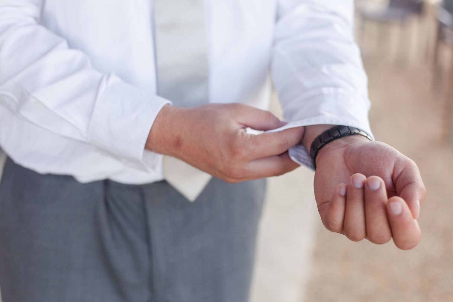 Close-up shots of hands and details of formal attire.