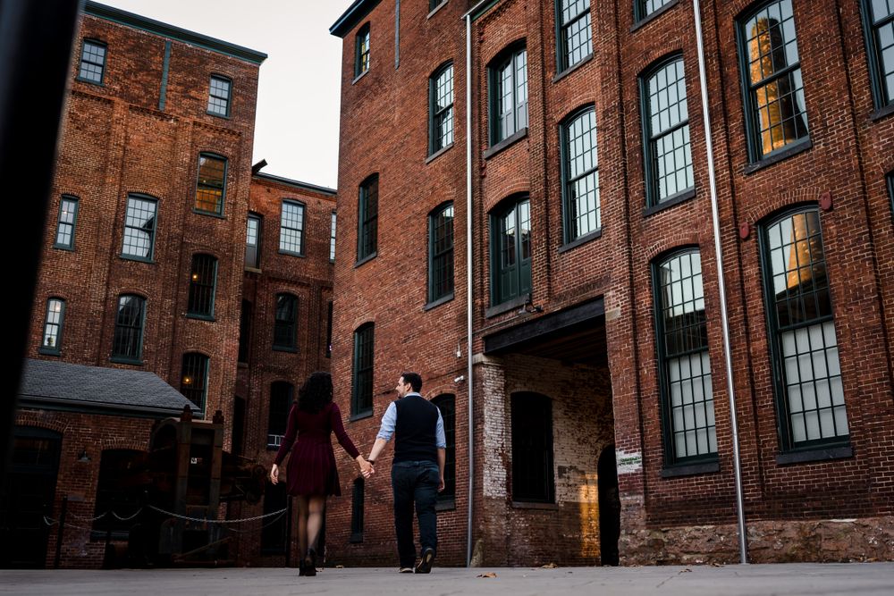 Angular view of historic brick buildings with industrial windows and architecture.