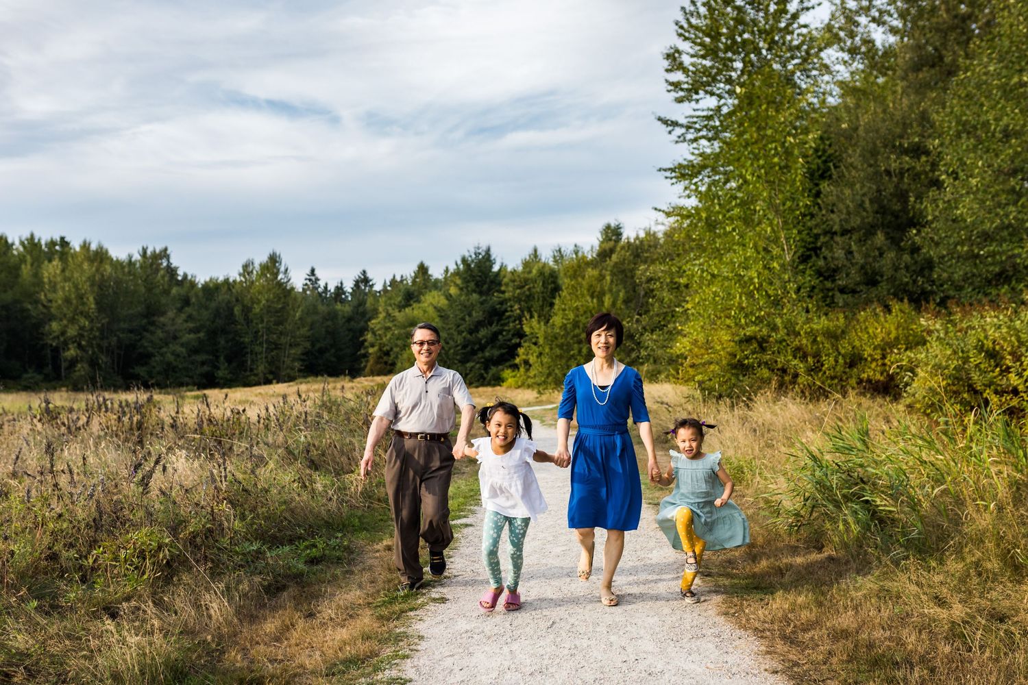 Grandparents and grandkids walk hand in hand