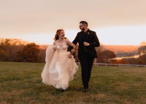 Sunset wedding portraits captured in a rustic outdoor setting.