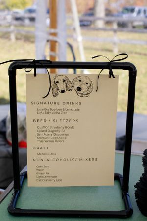 Wedding drink menu display showing signature cocktails and beverage options.