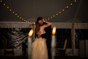 Wedding reception venue with string lights creating romantic ambiance.