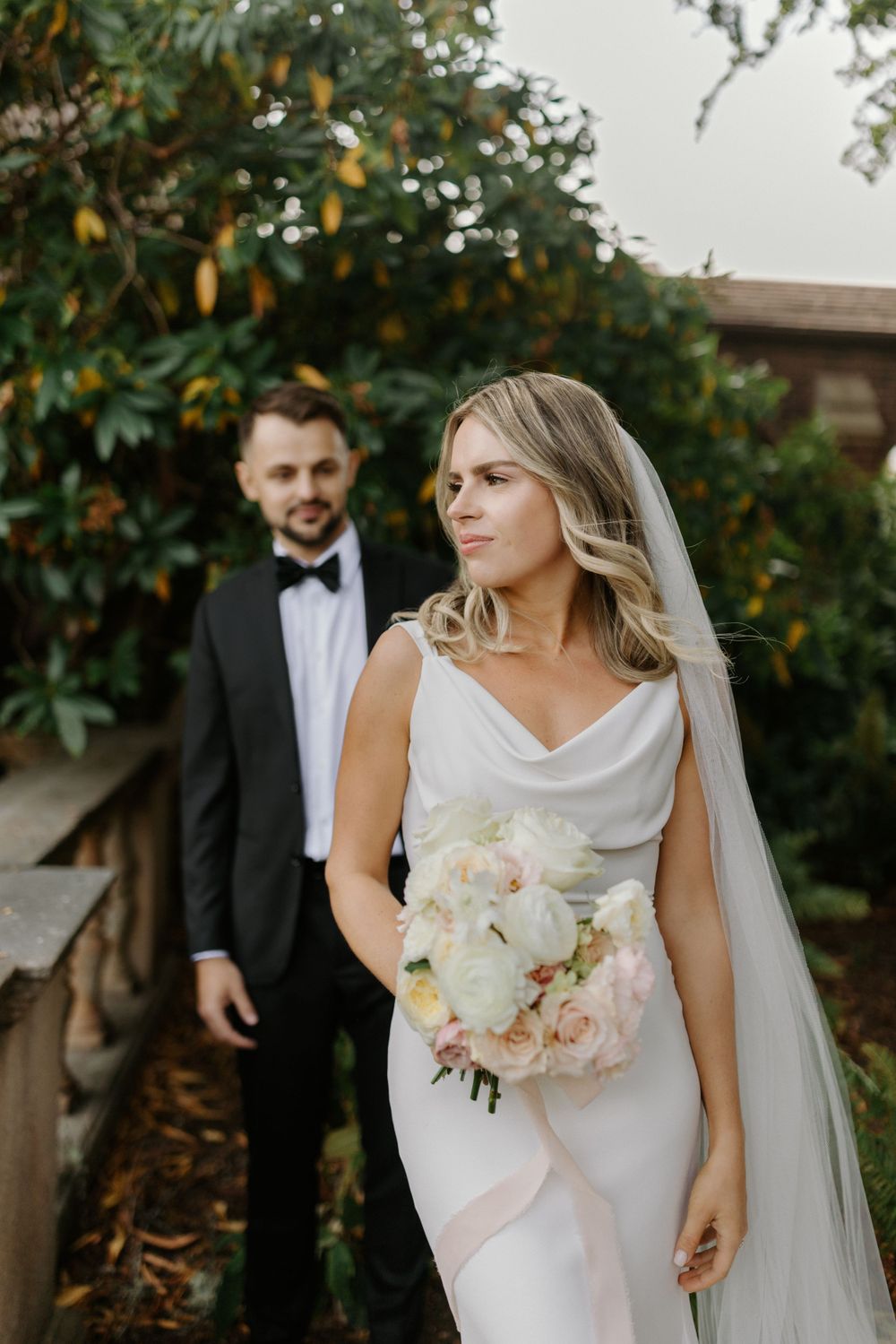Groom admiring his bride at the Univeristy of Puget Sound in Tacoma
