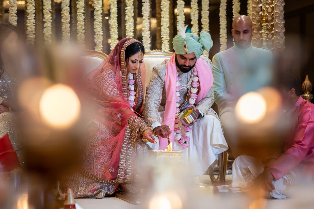 Romantic wedding ceremony space with hanging crystal decorations and soft lighting creating an intimate atmosphere.