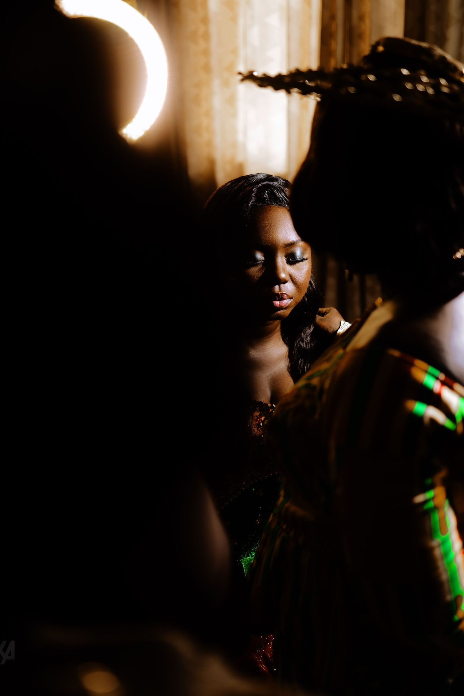 Dramatic low-light portrait series with warm lighting and artistic shadows.