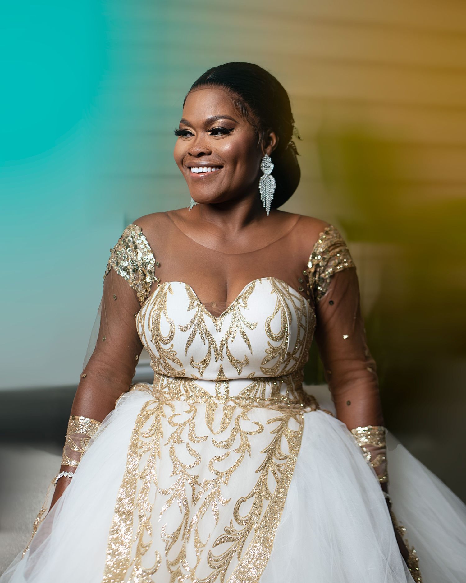 Close-up bridal photos showcasing intricate gold details on white wedding gown with sheer sleeves.