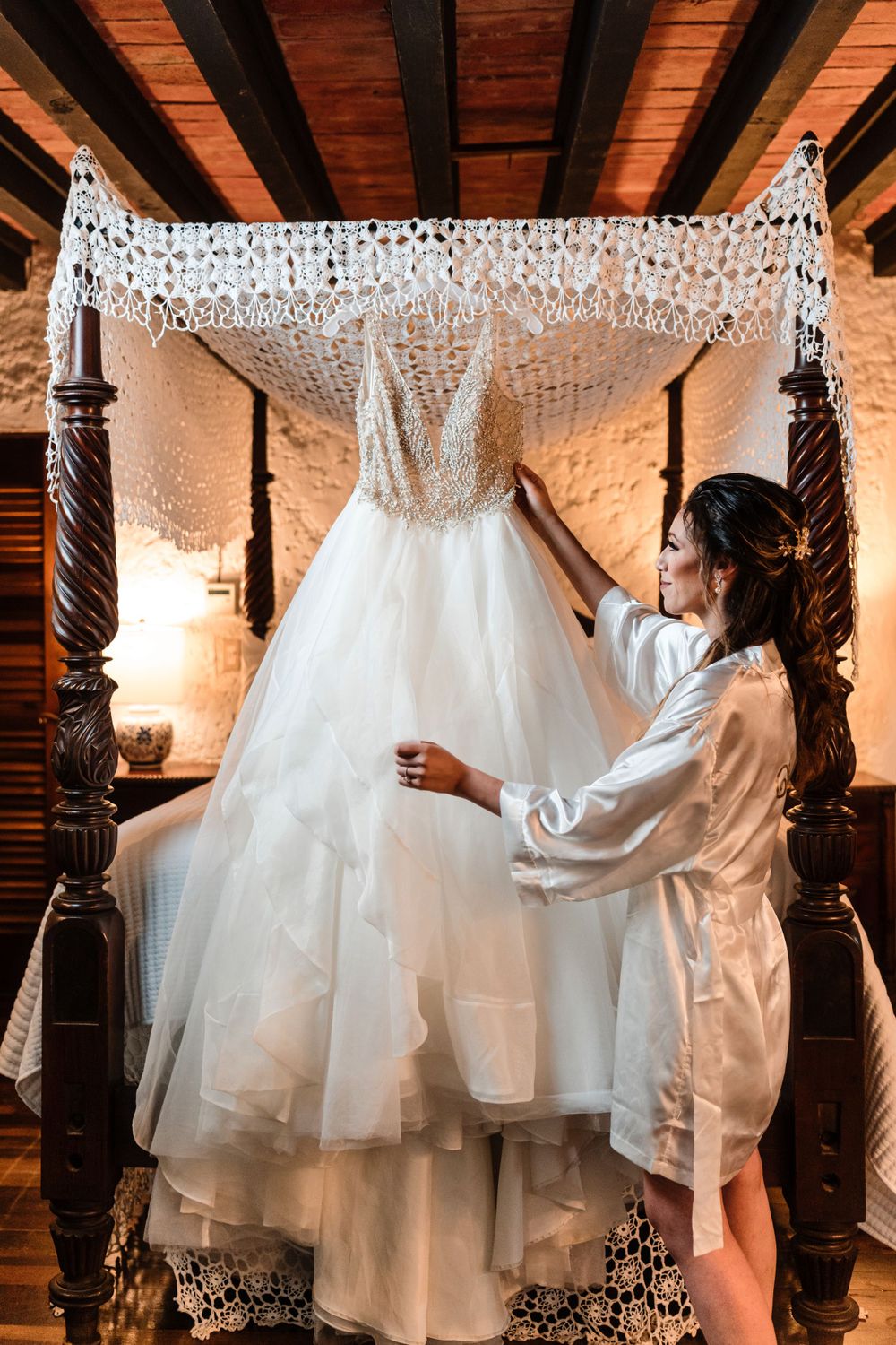 Bride looking at her dress at Hacienda Siesta Alegre.