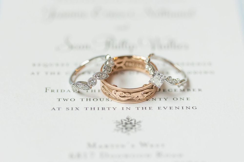 Wedding ring photos on a wedding invitation.
