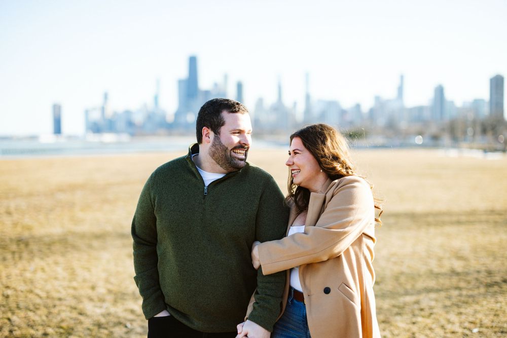 Iconic cityscape serves as a stunning backdrop for engagement photo session.